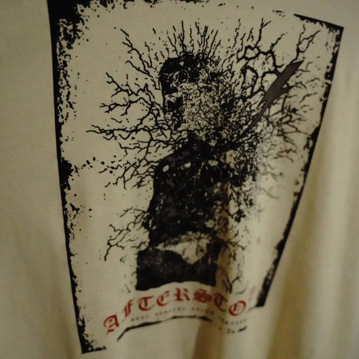 STRUCK GOD print detail on ivory garment-dyed cotton