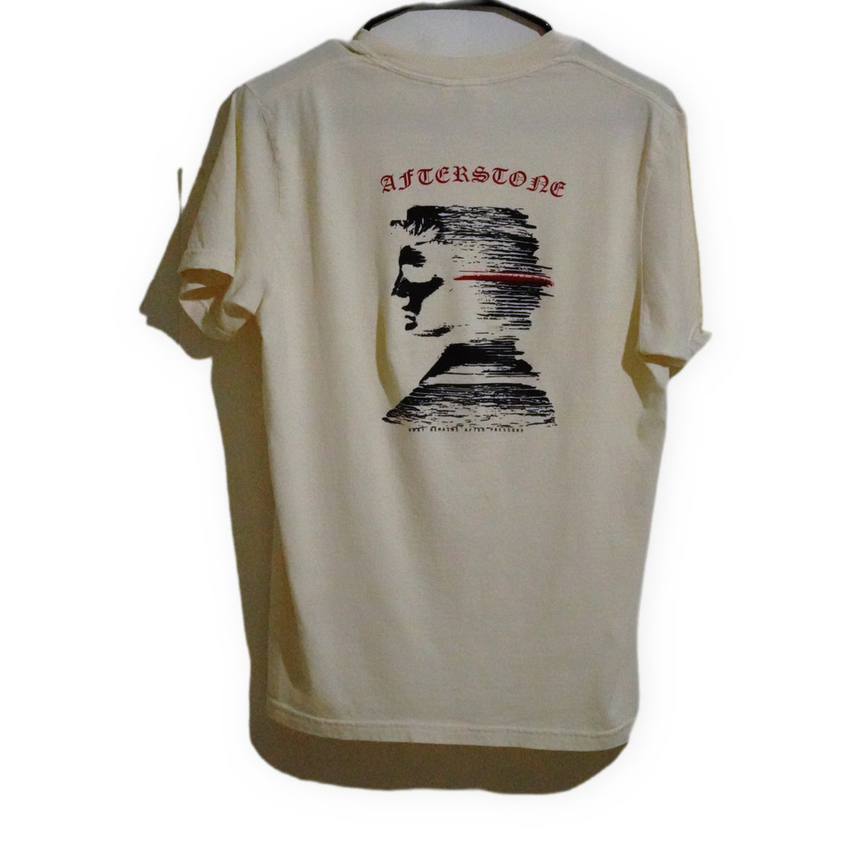 AFTERSTONE STRATUM HEAD heavyweight tee in ivory — full back graphic on a hanger