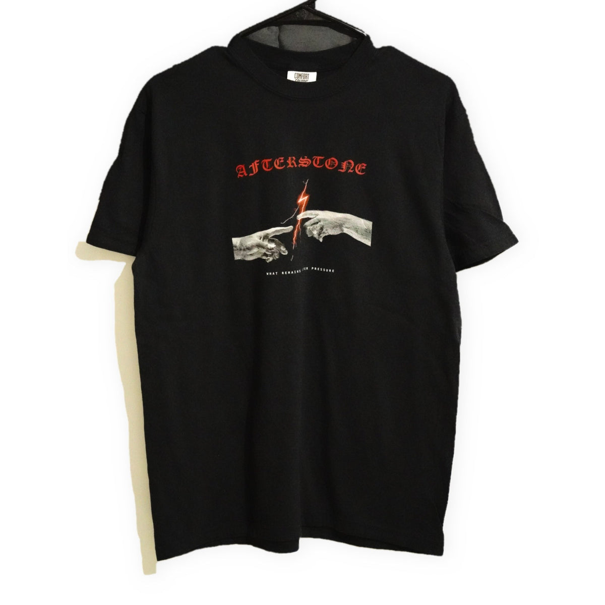 AFTERSTONE THE GAP heavyweight tee in black — two statue hands and a red lightning bolt printed on the chest