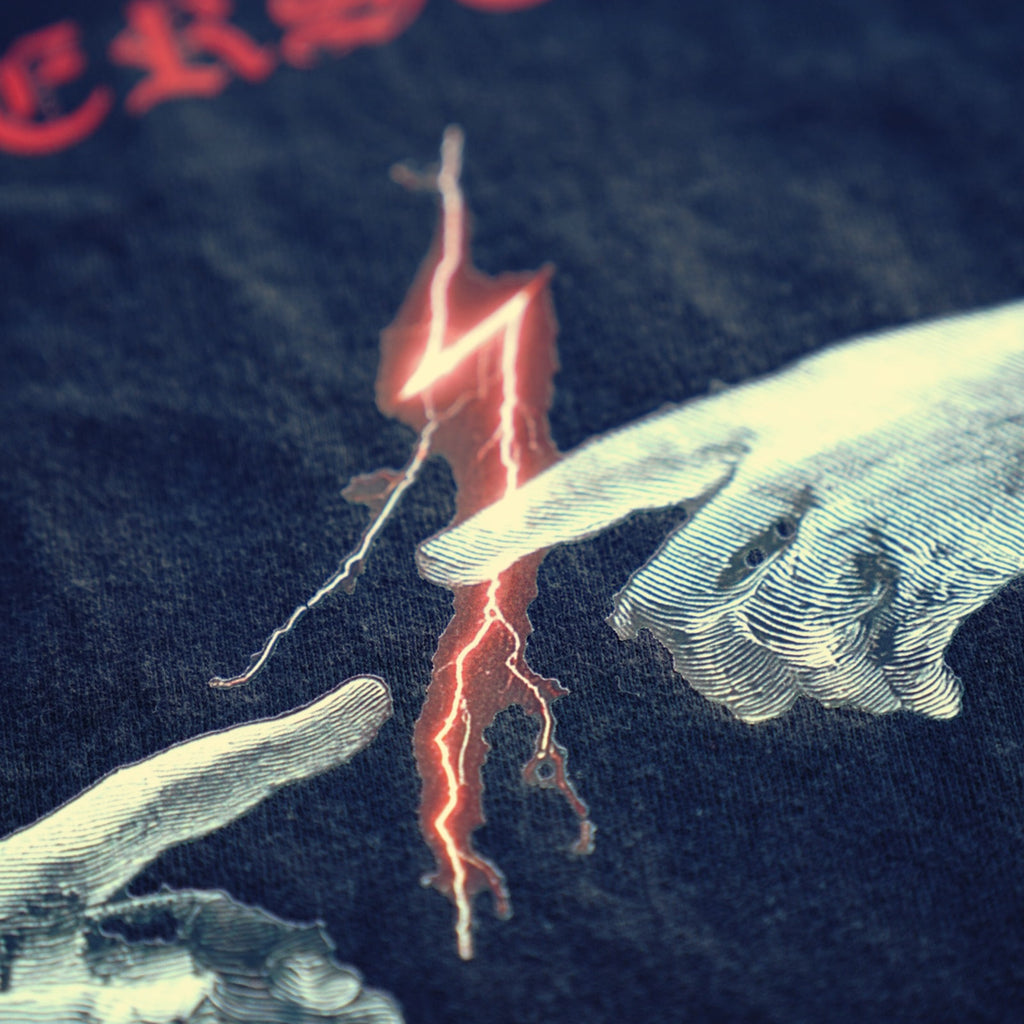 Macro of THE GAP red lightning bolt print on black cotton