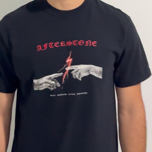 The black THE GAP heavyweight tee worn — two statue hands and a red bolt printed across the chest