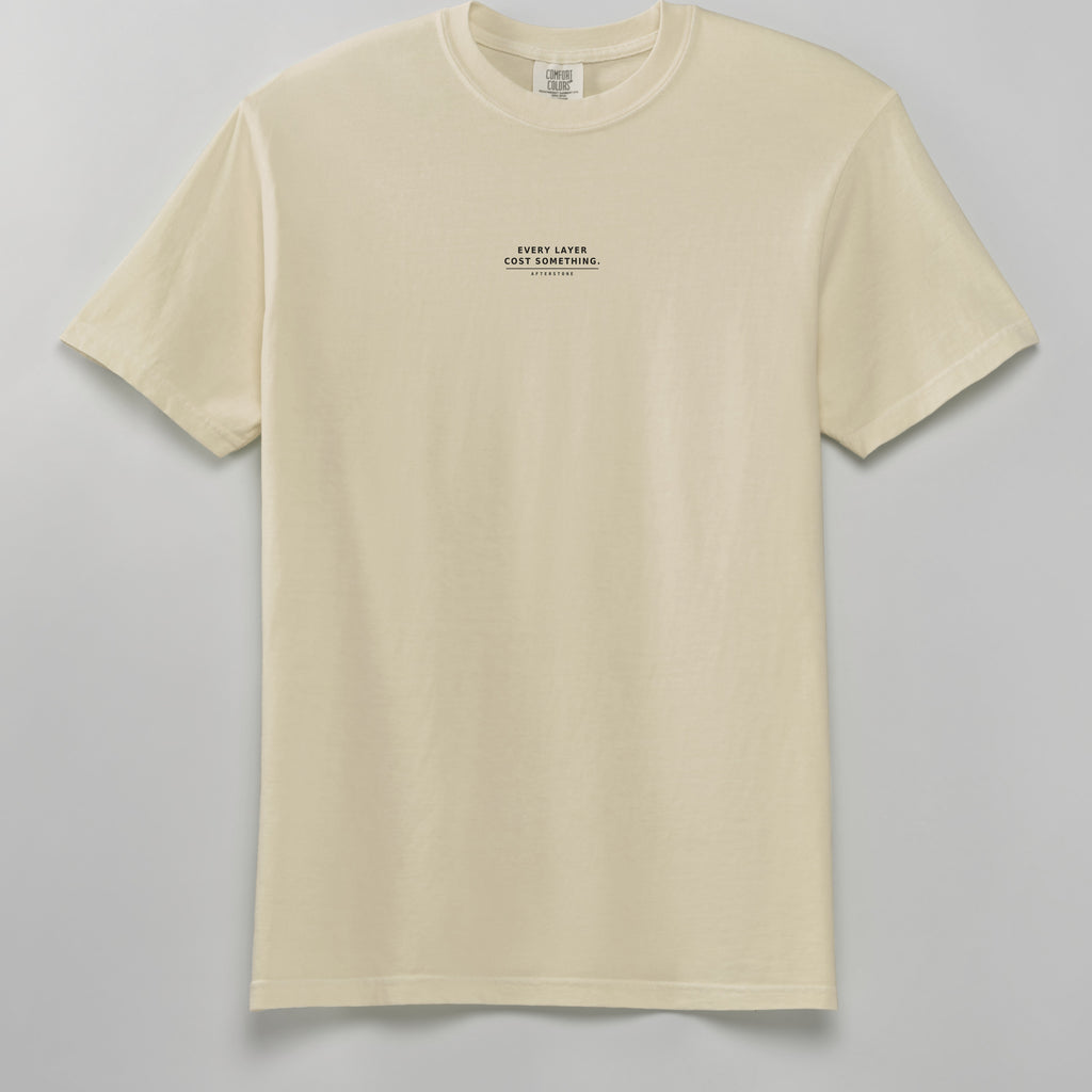 STRATUM HEAD heavyweight tee in ivory, front, EVERY LAYER COST SOMETHING phrase on the chest